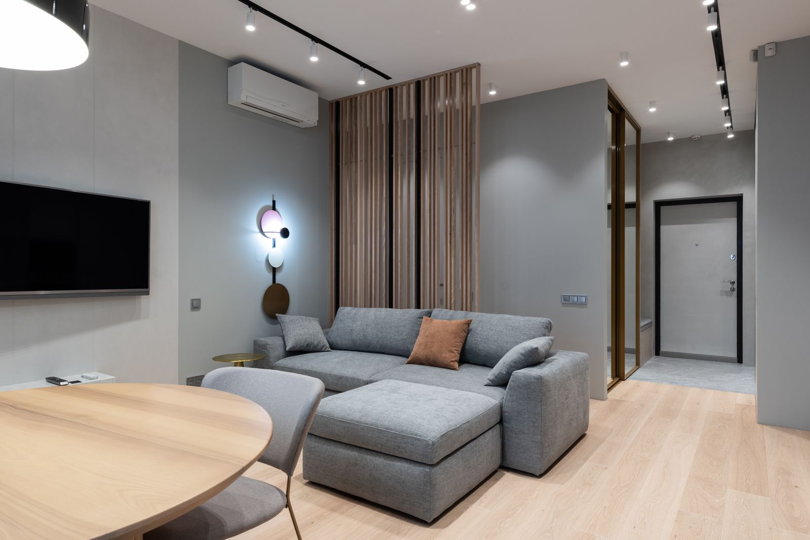 Wall-mounted air conditioning unit in a modern living room