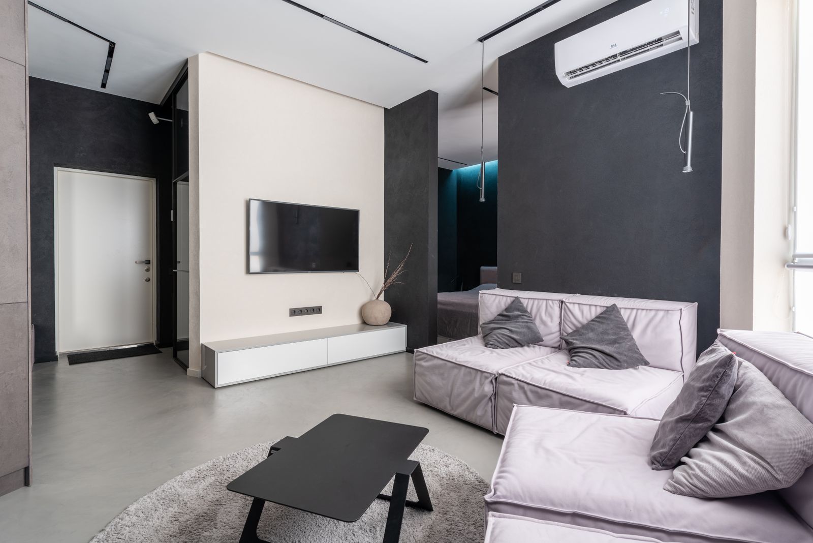 Split unit mounted on a dark feature wall